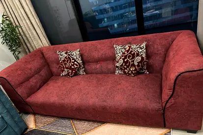Comfortable 3-seater red fabric sofa - good condition