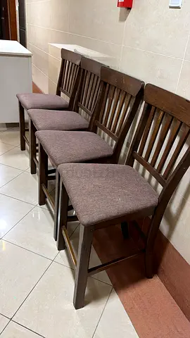 Set of 4 wooden dining chairs with fabric seats - good condition