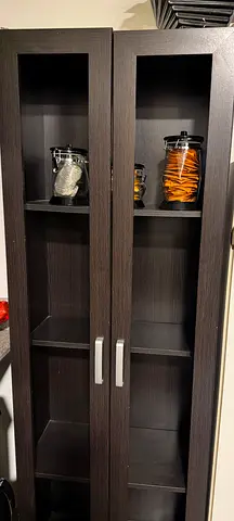 Tall dark brown storage cabinet with glass doors - good condition