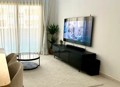 Living room soundbat unit with woofer.