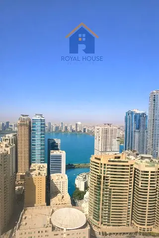 2BR apartment for sale in Al Rose Tower, 1,100 sqft, private parking, prime location. AED 600,000.