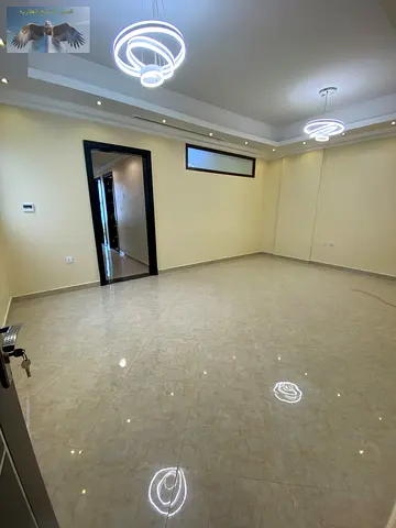 Three-bedroom apartment with a living room in Al Rawda Ajman for annual rent Highend finishes in a luxury building with free maintenance throughout