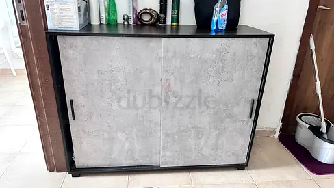Shoe cabinet and Dining Table           Compact concrete-look sliding door cabinet — good condition