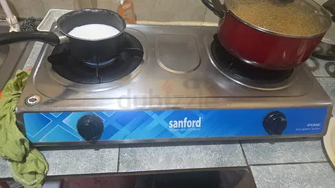 Sanford 2-Burner Stainless Steel Gas Stove - Good Working Condition with medium size gas cylinder