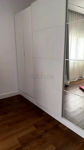 White Sliding Door Wardrobe with Mirrored Panel - Good Condition. Light usage