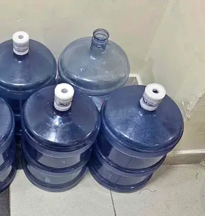 5 x 19L Water Cooler Jugs (Used) - Blue PET Bottles