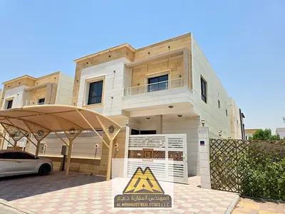Villa for annual rent in Al Yasmin – Ajman First occupant | 5 master bedrooms | Spacious internal yard | Outdoor setback | Carport | Prime location