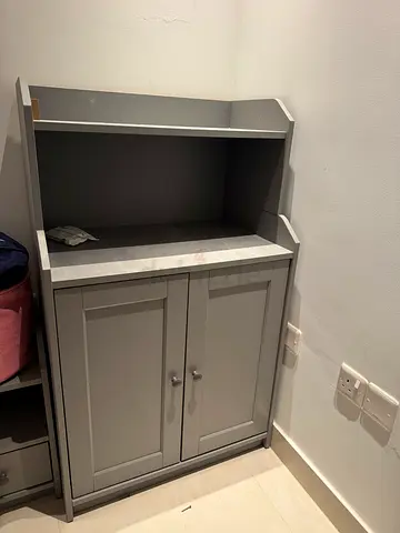 Grey storage cabinet with shelves and doors - good condition