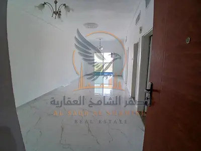 One-bedroom apartment on Khalifa Street for annual rent in Ajman Prime location close to amenities with a balcony and private parking