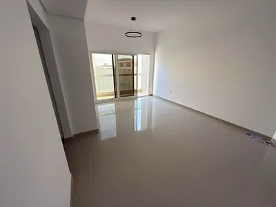 1BR in Al Jurf 3, balcony, master room, 2 baths, central AC, prime location near services.