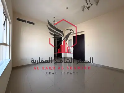 Apartment for annual rent - Abu Shagara. Spacious areas, open view, free maintenance, central air conditioning, prime location close to all services.