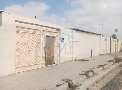 For sale: A house in Al Qasimia, Al Heera suburb, with an area of ​​6400 sq ft, consisting of eight rooms, four bathrooms, and three kitchens. For sa