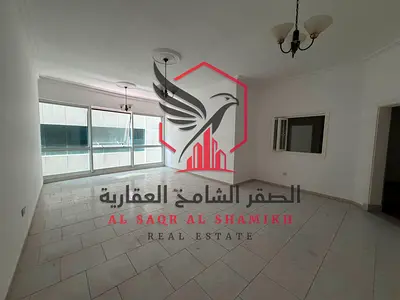 شقة واسعة للإيجار السنوي المجاز2 غرفتين نوم وصاله تكييف مجاني مسبح مجاني تكييف مركزي صيانه مجانيه قريبه علي مخرج دبي