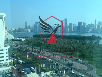 One month free sea view, largest one-bedroom apartment with free AC, free parking, free gym and pool, excellent finishing, for rent in Al Majaz 1
