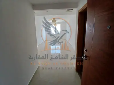 Two-bedroom apartment with a living room for annual rent in Al Nuaimiya 3, Ajman, with a city view. A great opportunity to live.