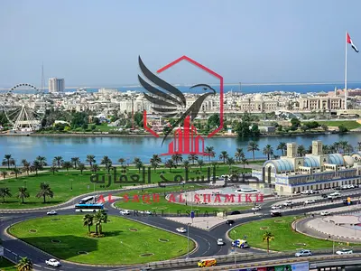 2BR + living room, balcony & sea view | Free parking & maintenance | Easy payment, cheque deposit | Near Dubai exit.