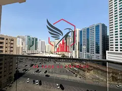 2BR apartment with living room in Al Majaz 2, balcony & free parking. Prime location near cafés, sh
