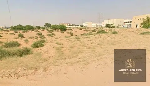 Prime commercial plot for sale in Al Helio 1, Ajman, corner plot on two streets in a strategic location, Ground Floor + Mezzanine permit, freehold own