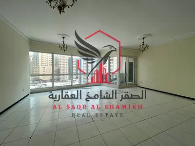 Luxury 3BR apartment for annual rent in Al Majaz 2, free AC, balcony with a stunning view.