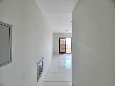 1BR in Al Nuaimiya, master room, balcony, wardrobes, central AC, prime Sheikh Khalifa Road.