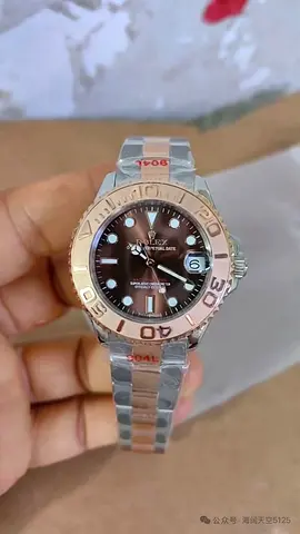 This is a Rolex Yacht-Master featuring a chocolate brown dial and an 18K Everose gold bezel.