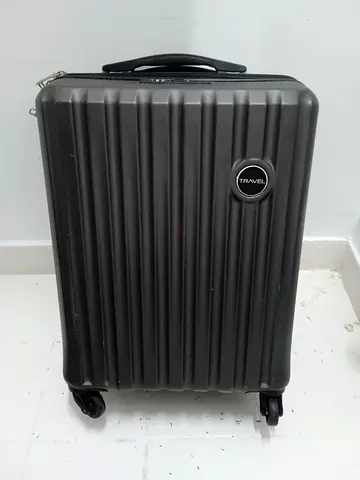 Black hard-shell carry-on suitcase with 4 wheels - good condition