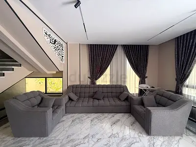Grey fabric sofa set including 3 seater and two armchairs