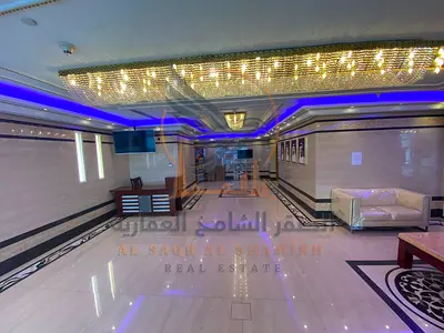 Two-bedroom apartment with a living room and private parking available for annual rent on Khalifa Street, opposite Grand Mall. Near Murad Mall.