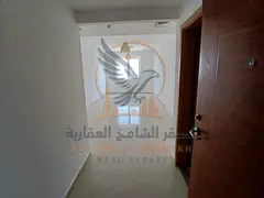 Annual rental apartment in Al Nuaimiya 3 with 2 bedrooms, living room, balcony, city view, parking, 