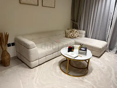 L-shaped cream tufted sectional sofa in excellent condition