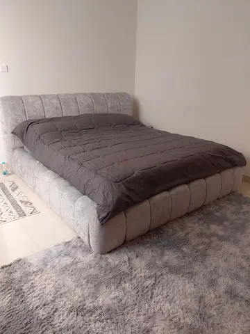 King size upholstered bed frame with headboard.