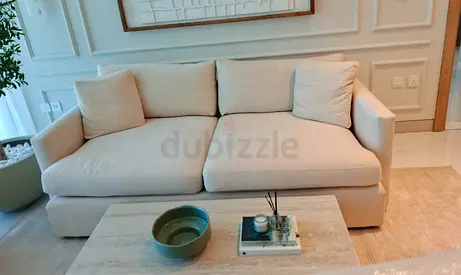 Crate and Barrel beige color sofa