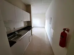 New studio in Al Nuaimiya, separate kitchen, prime location on Sheikh Khalifa Road.