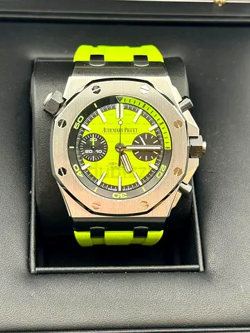 The watch is an Audemars Piguet Royal Oak Offshore Diver Chronograph with a vibrant lime green dial