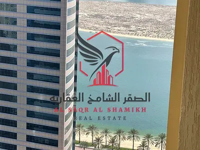 Beautiful sea view, two bedrooms and a living room with parking + free gym and pool, built-in wardrobes for rent in Al Khan
