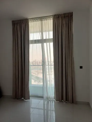 Beige blackout curtains with white sheer - set for balcony window
