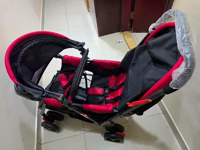 Lightweight double-seat stroller in black and red - good condition