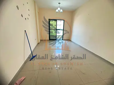 Annual 1-bedroom apartment for rent in Ajman with balcony and 2 bathrooms at a great price, near Al Hikmah School and Emirates Markets