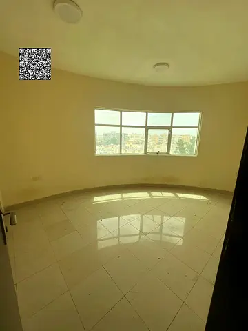 Available for annual rent in Ajman (Al Nuaimiya 2 area), very close to all amenities: a 2-bedroom apartment with a living room and two bathrooms. The