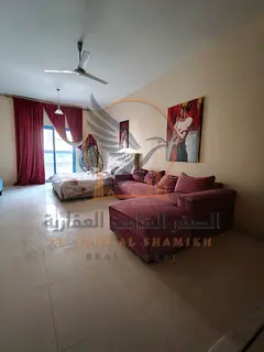 Furnished studio for rent in Al Rawda with balcony and spacious layout, near Hashim Market and Dua P