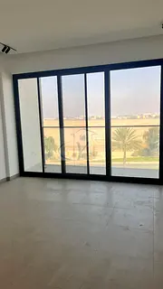 Two bedrooms and a spacious living room for sale with a view of the golf course in Al Zorah, Ajman