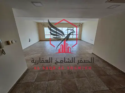 Apartment for annual rent - Al Majaz 2. Features include air conditioning, gym, swimming pool, free parking, spacious areas, open view, free maintenan