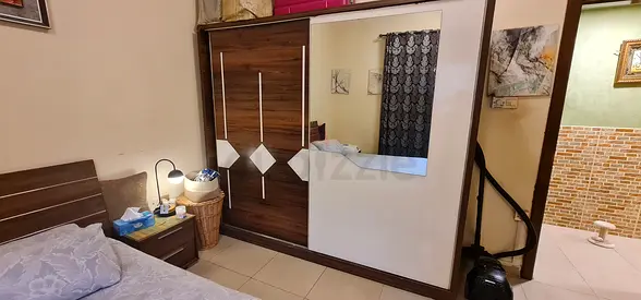 Large wooden wardrobe with sliding mirror doors - good condition