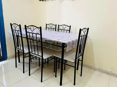 6-Seater Black Metal Dining Table with Chairs - Good Condition. Only 5 chairs are available