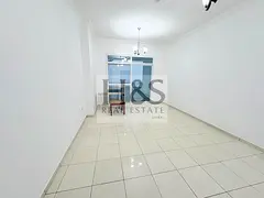 Majan 1BR Apartment | High-Floor City View | Balcony