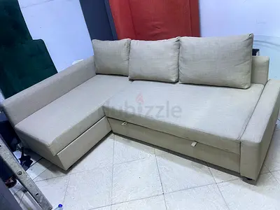 Light beige L-shaped sectional sofa with storage — good condition