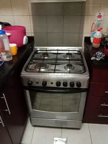 Stainless Steel 4-Burner Gas Stove with Oven - Good Working Condition
