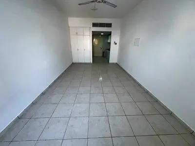 Studio apartment next to Safeer Mall, spacious, built-in wardrobes, semi-separate kitchen, central air conditioning, easy access to Sharjah, Dubai