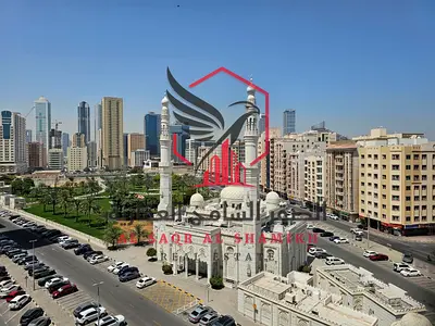 Two-bedroom apartment with a living room and a balcony overlooking Al Safya Park, in one of the most beautiful towers in Sharjah