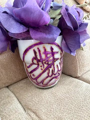White Ceramic Vase with Purple Calligraphy and Artificial Flowers